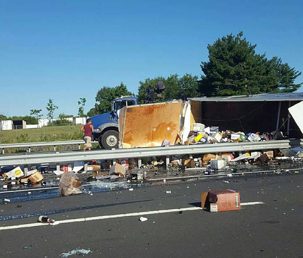 Huge Turnpike backup: Overturned box truck spills its load