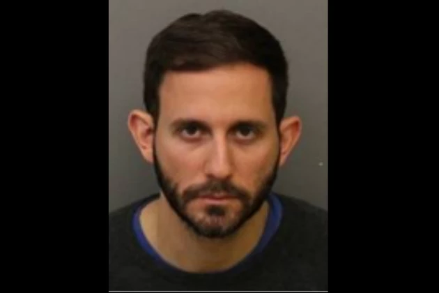 NJ teacher and coach charged with raping teen boys