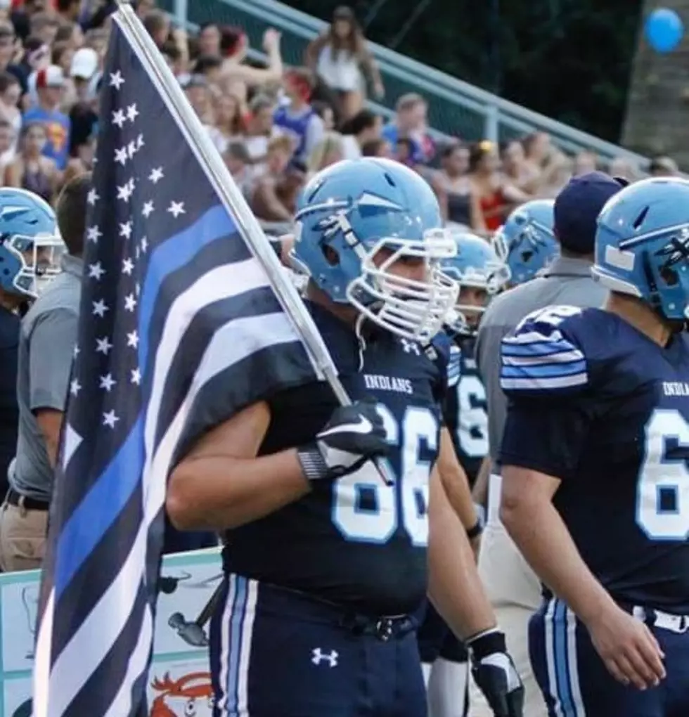 High school football captain honors law enforcement during games