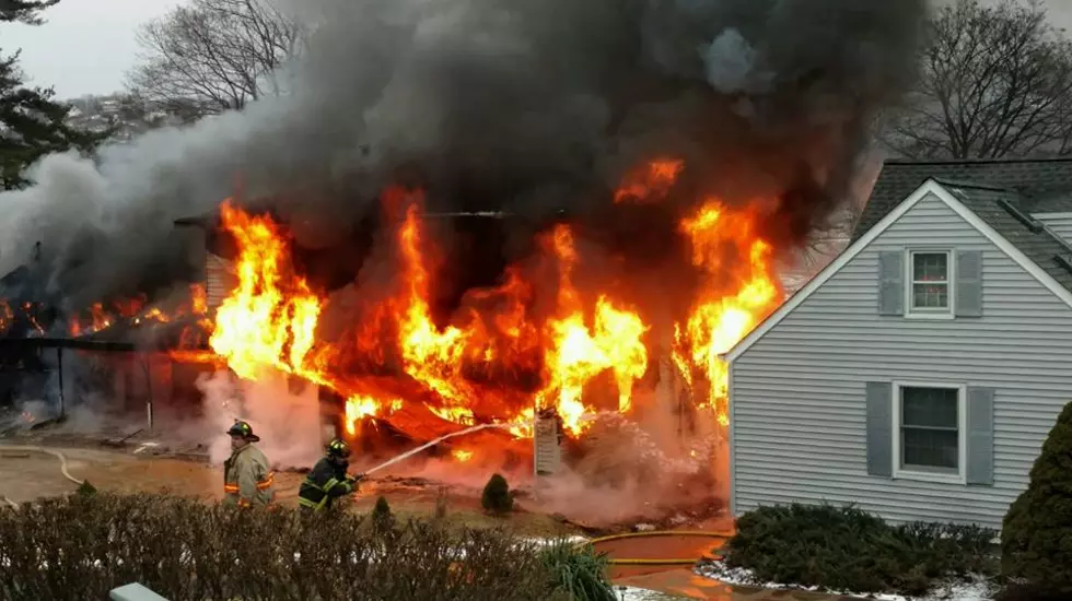 As NJ house goes up in flames, napping man closes door on rescuers