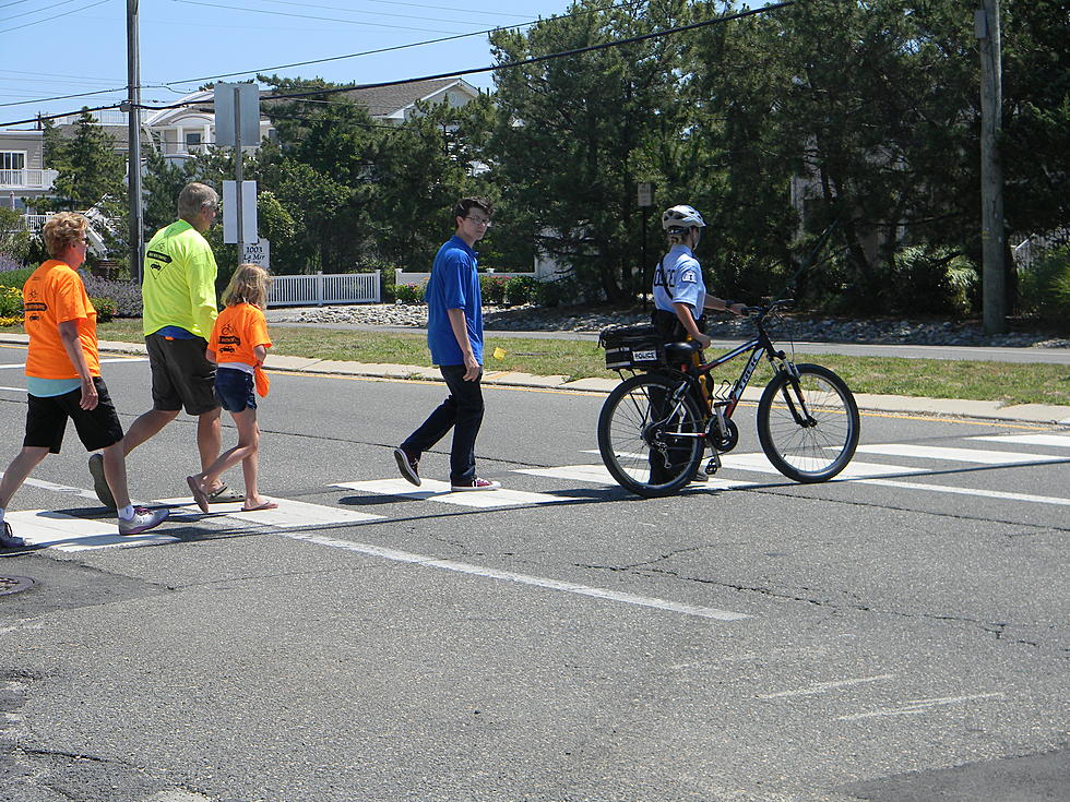 Carrying a flag to cross the street — Middlesex towns trying it