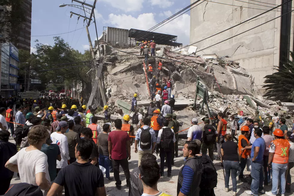 Mexicans dig through collapsed buildings as quake kills 217