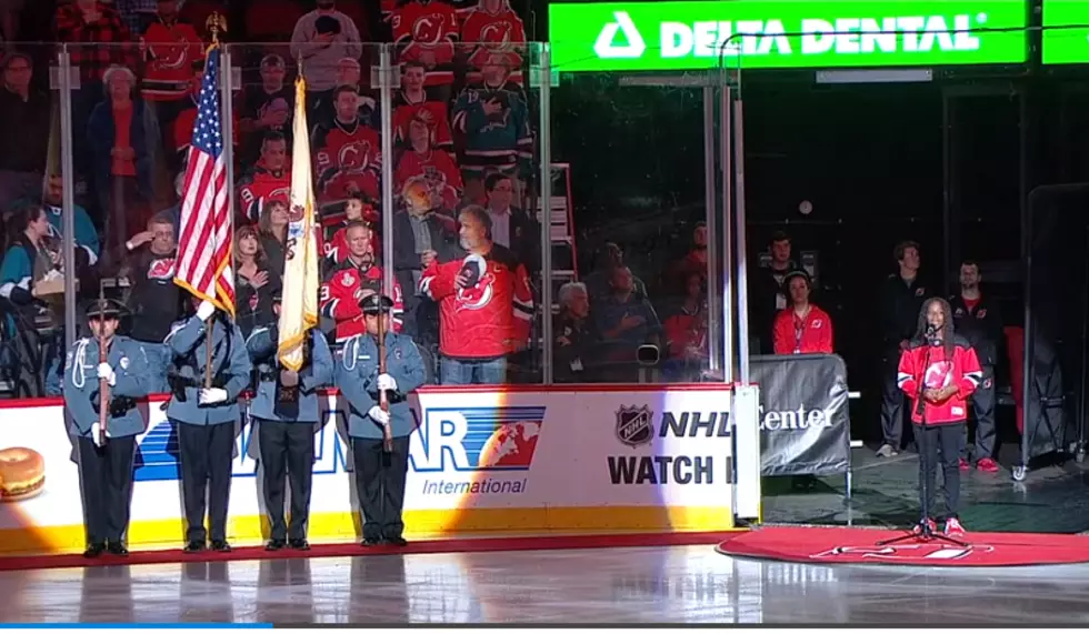 After mishap, Devils fans help young singer complete national anthem