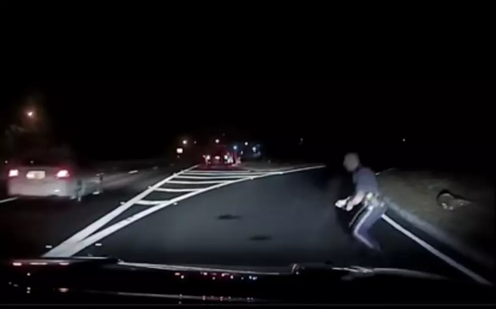 Manchester cop nearly run over by swerving car (Video)