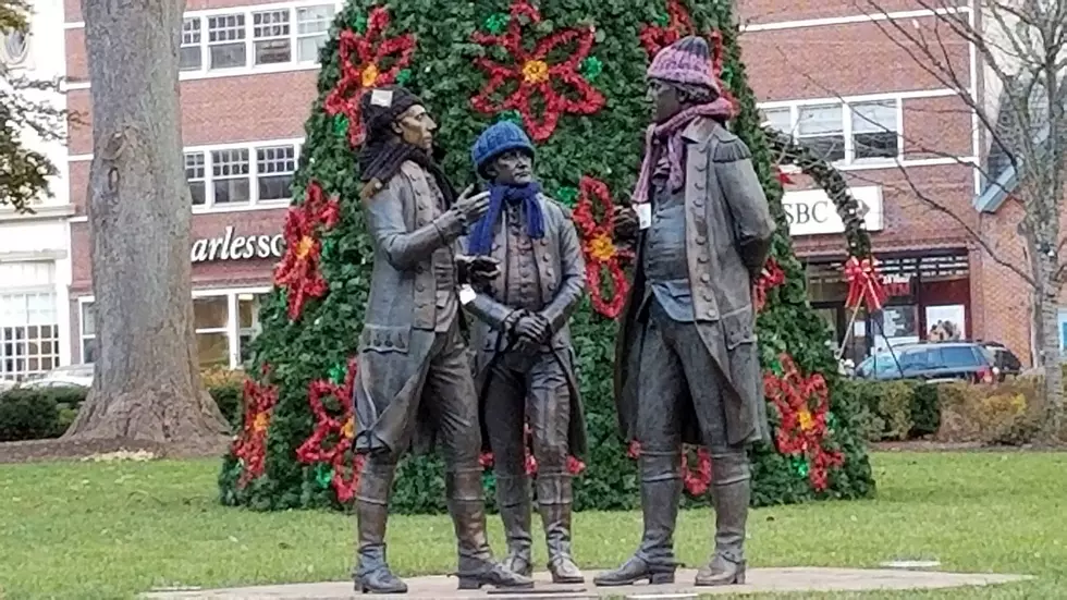 Who’s leaving hats & scarves for the needy on Morristown statues?
