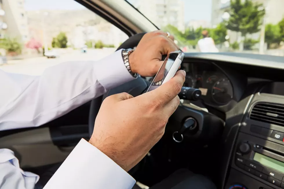 It’s time to admit that we can hold a phone while driving!