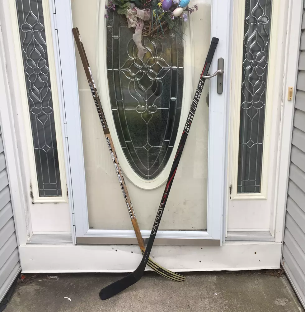 Why there are hockey sticks on front porches this week