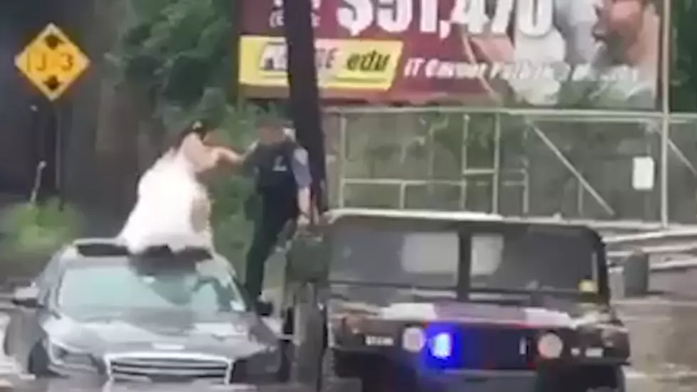 Bride rescued as insane NJ floods overwhelm car