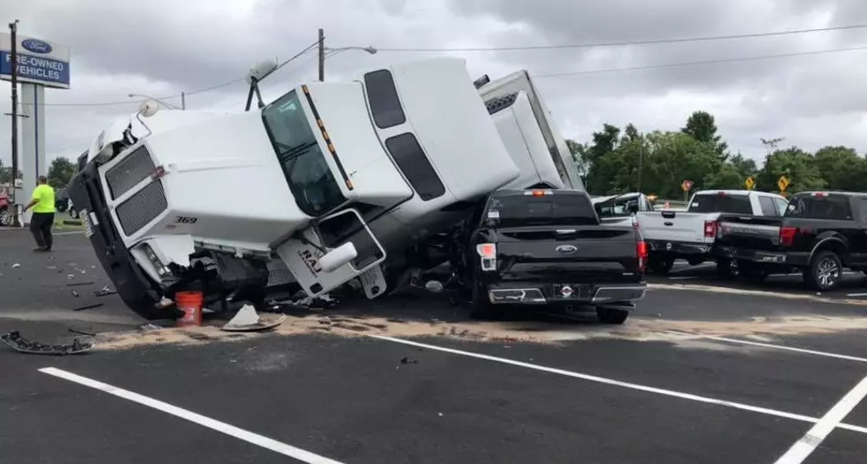 Tractor-trailer gets cut off, crashes into Route 35 dealership