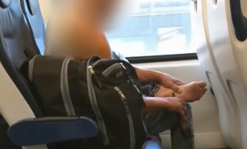 Guy sands his feet with power tool on NJ Transit train 