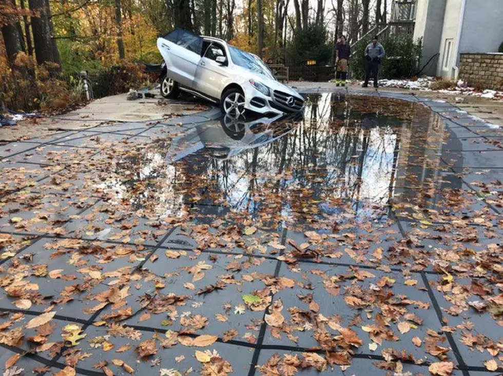 SUV rolls down embankment and into Holmdel pool