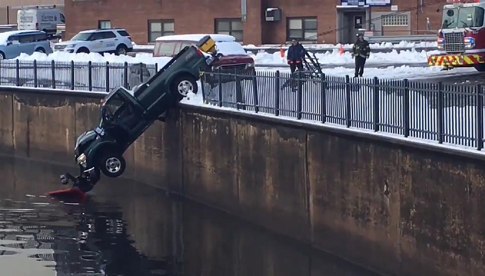 Snow truck slides through guardrail, hangs above NJ river Monday