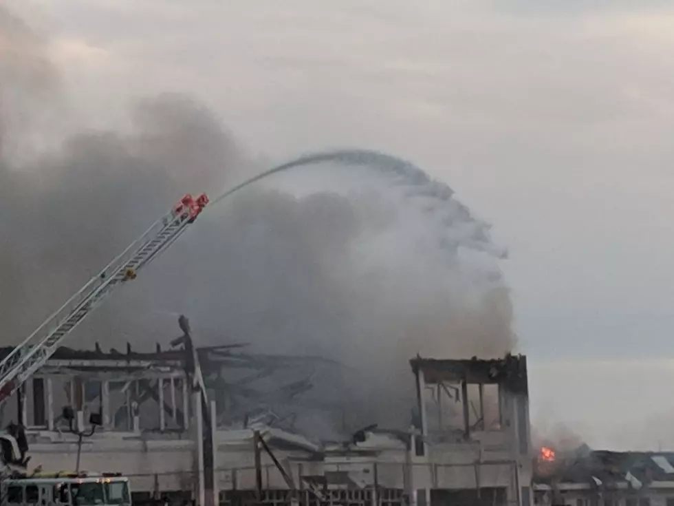 Firefighters pour water on the Dunes pavilion fire in Ocean Grove