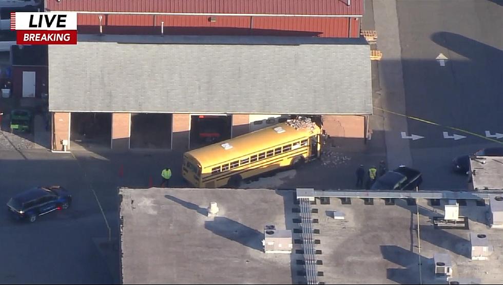 School bus crashes into garage on NJ high school property