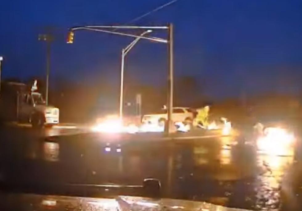 SHOCK: Crew handles live power line as it starts fire after storm