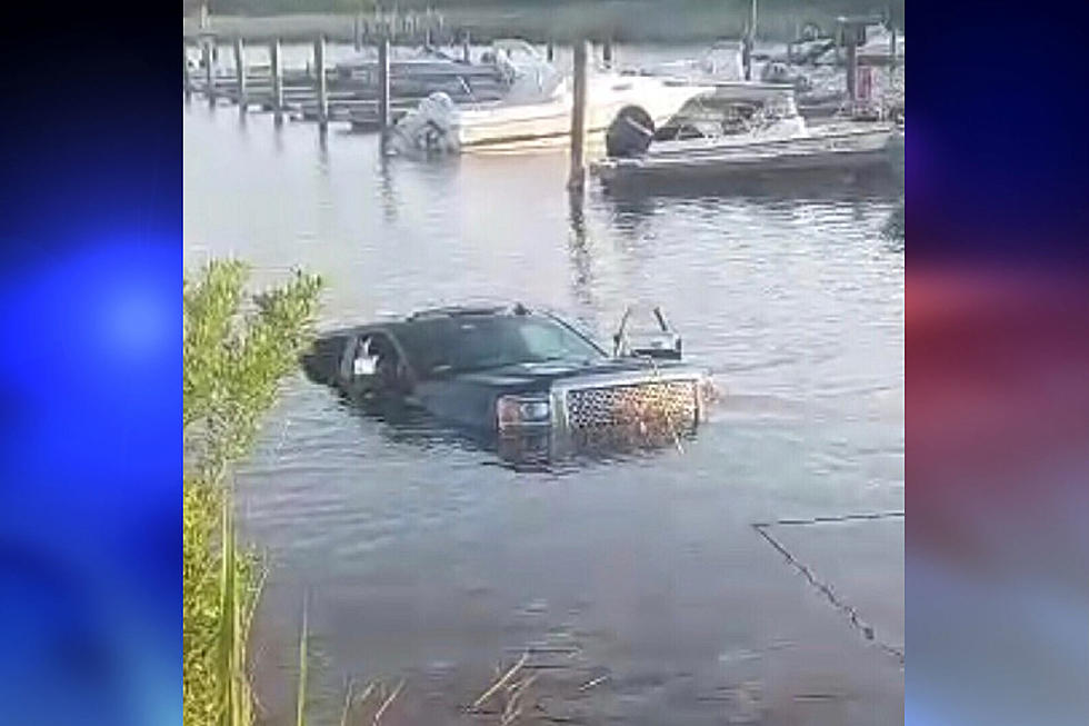 Truck, trailer and boat roll into NJ river