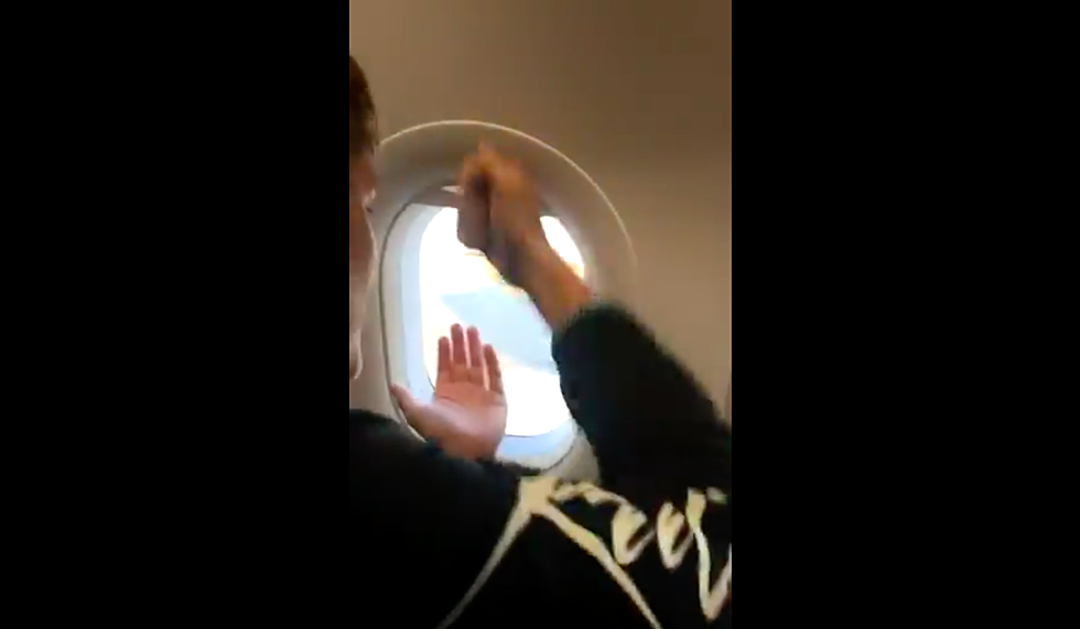 Watch! Airplane passenger plays rock, paper, scissors with worker