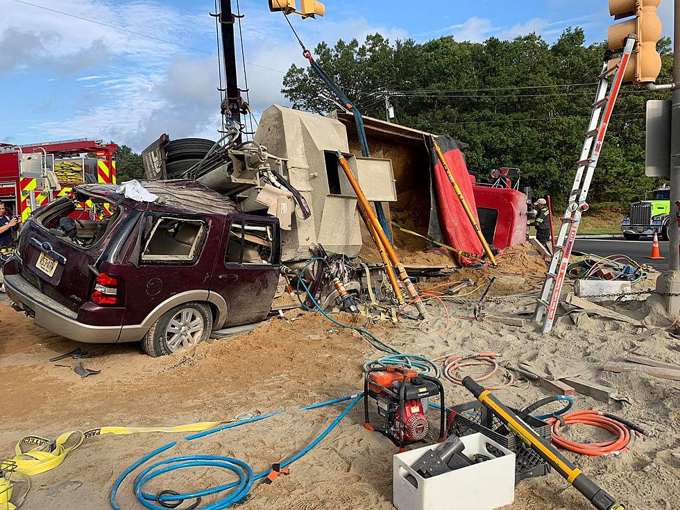 Woman survives her SUV being crushed by dump truck in Wall