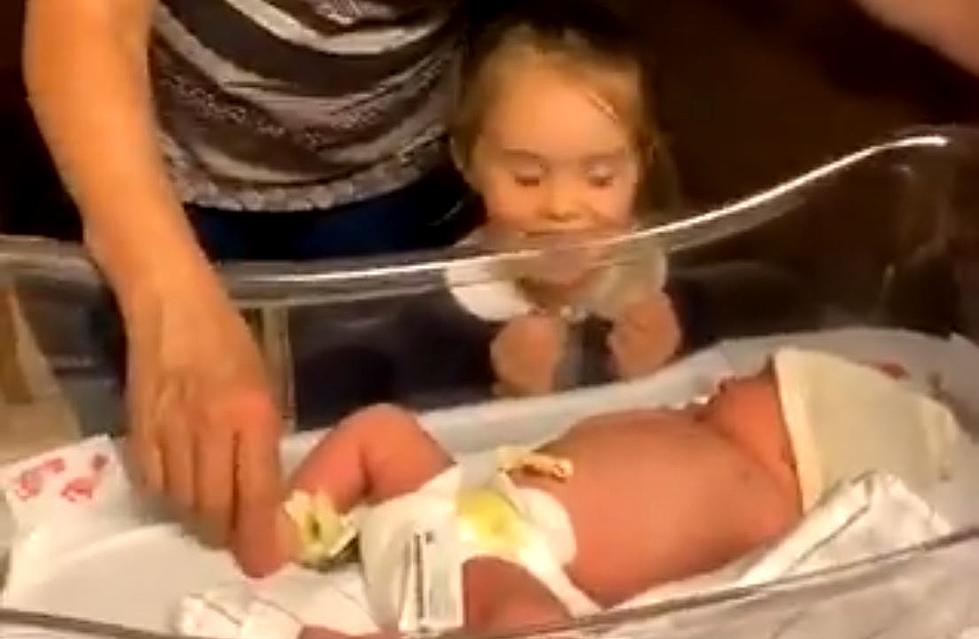 Little girl sings Eagles Fight Song to newborn sister