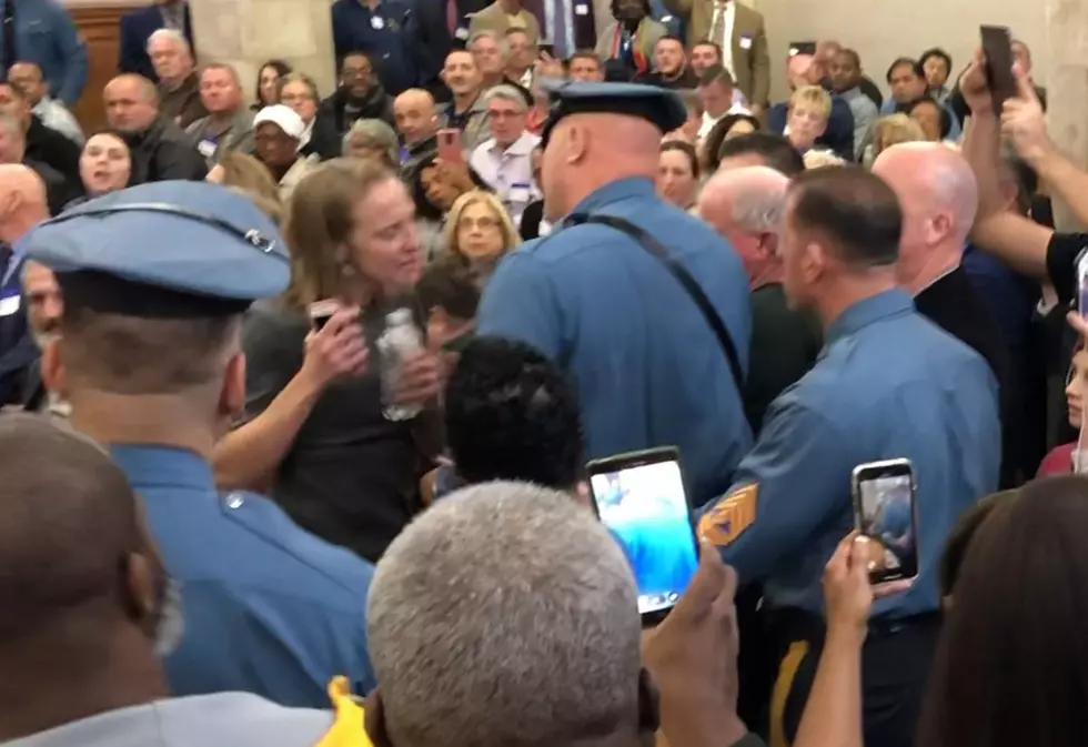 Protester dragged from NJ powerbroker hearing
