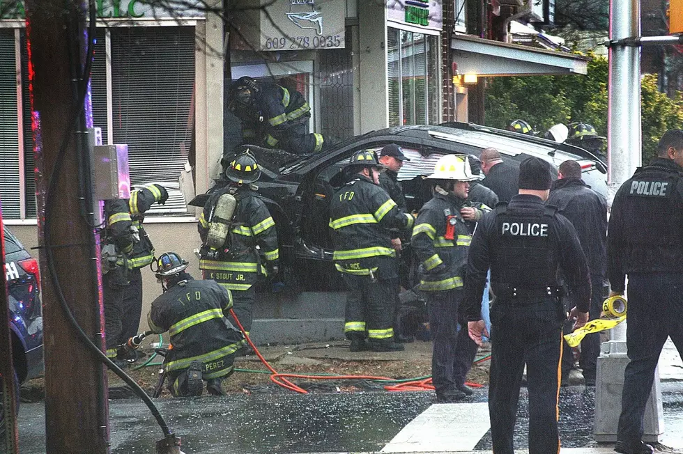 Vehicle sent into a building after colliding with a Trenton police vehicle