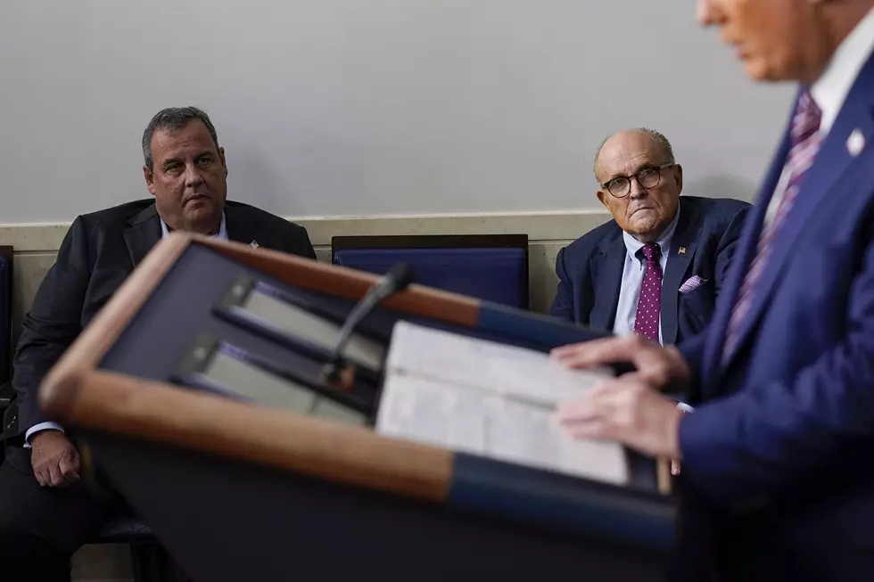 Former Gov. Chris Christie, and former New York Mayor Rudy Giuliani sit to the side during a White House news conference