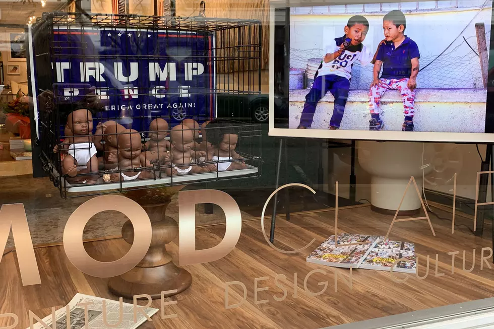 NJ artist uses caged baby dolls &#038; Trump sign in immigration piece