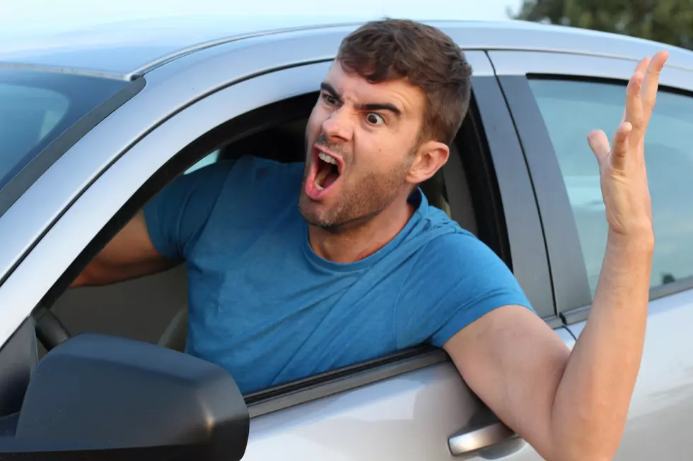 Angry man driving a car.