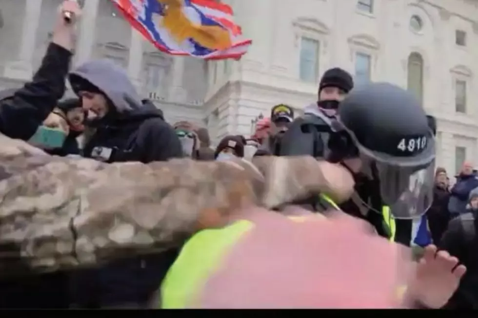 Scott Fairlamb punches a Metro police officer