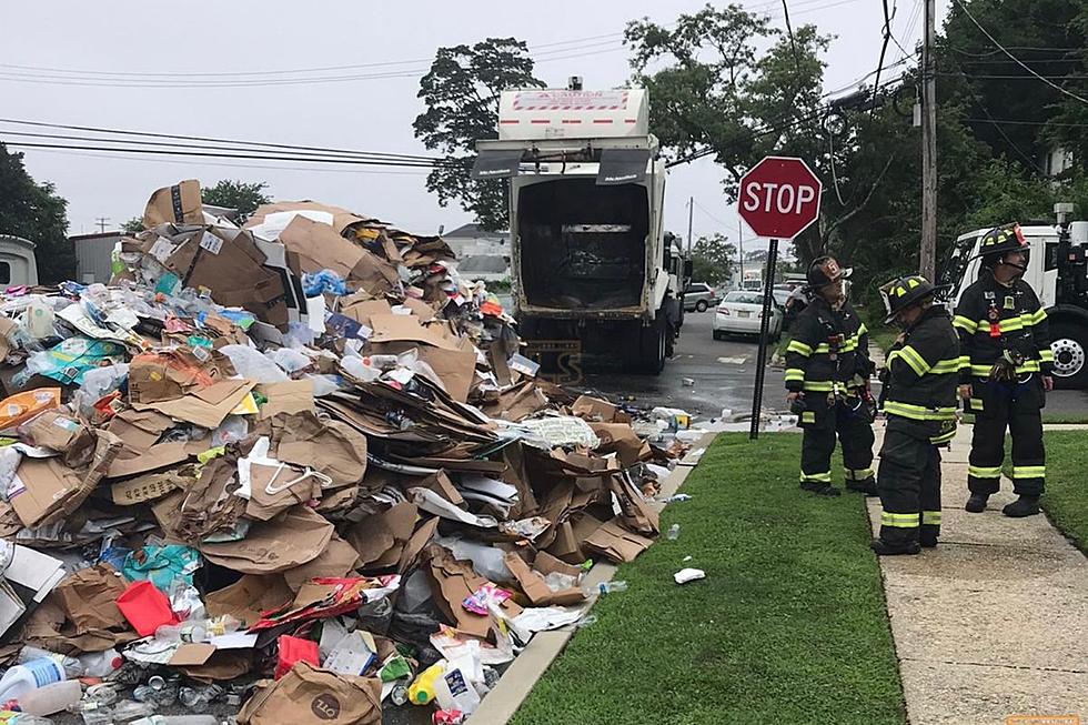 Lakewood, NJ garbage truck empties onto street after scooter fire