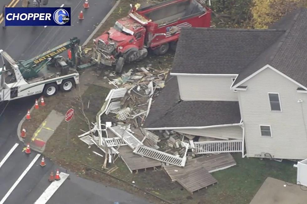 Dump truck demolishes NJ house, 80-year-old man falls into cellar