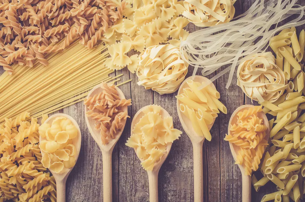 Mix of pasta on an old wooden table