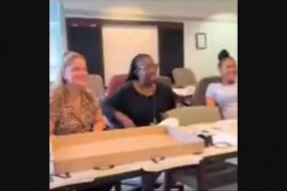 Trenton city employees watch as Public Health Officer Yvette Graffie-Cooper receives a cellulite-reduction massage. (WisdomBody)