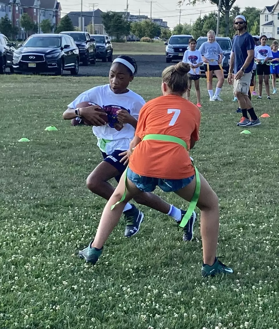 Girls flag football gaining yardage in New Jersey.