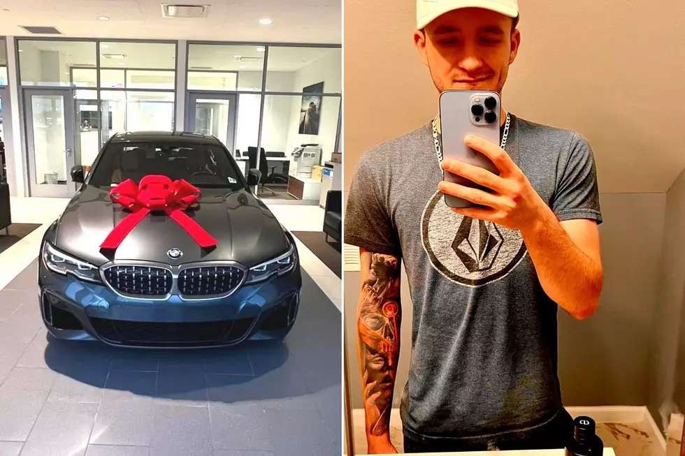 Eryk Wnek and his 2020 BMW with a red ribbon. (Eryk Wnek via Facebook)