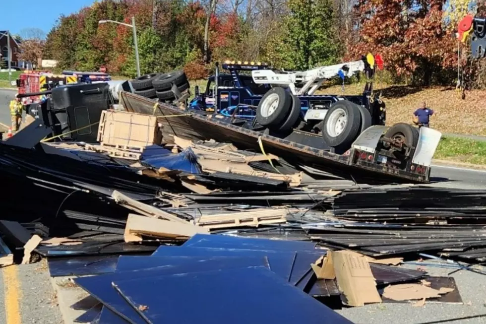 Truck flips to avoid stopped car, spilling plywood onto NJ road