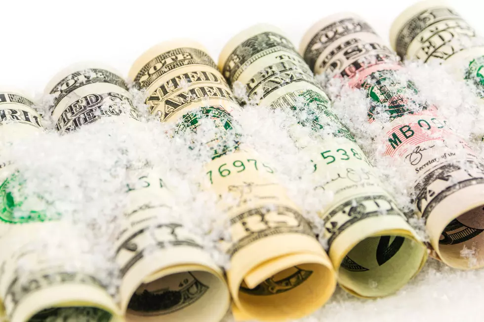 american dollar banknote rolls in all denominations covered with snow