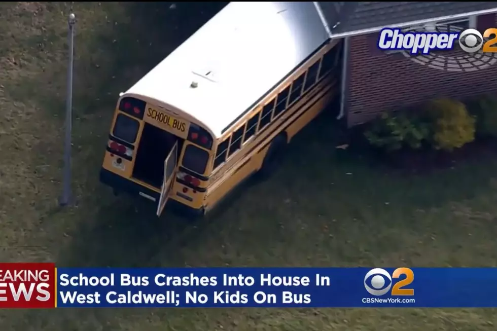 School bus crashes into side of NJ house, driver charged with DUI