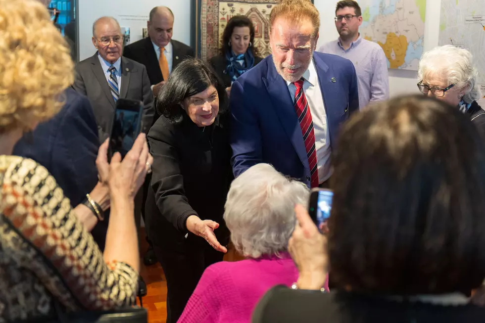 Gail Rosenthal, left, director of the Sara & Sam Schoffer Holocaust Resource Center at Stockton University, introduces Arnold Schwarzenegger to Holocaust survivor Elizabeth Roth (seated) March 6. Stockton University/ Bernie DeLury