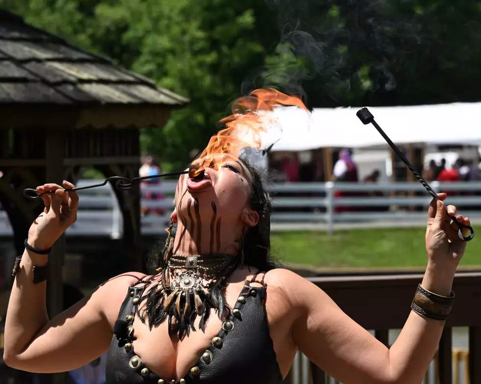 “Adamo Ignis swallowing/breathing fire,” Photo credit- Richard Jones