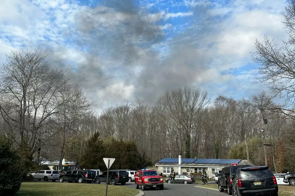 Smoke from an exploded house rises above Cedar Court in Roosevelt