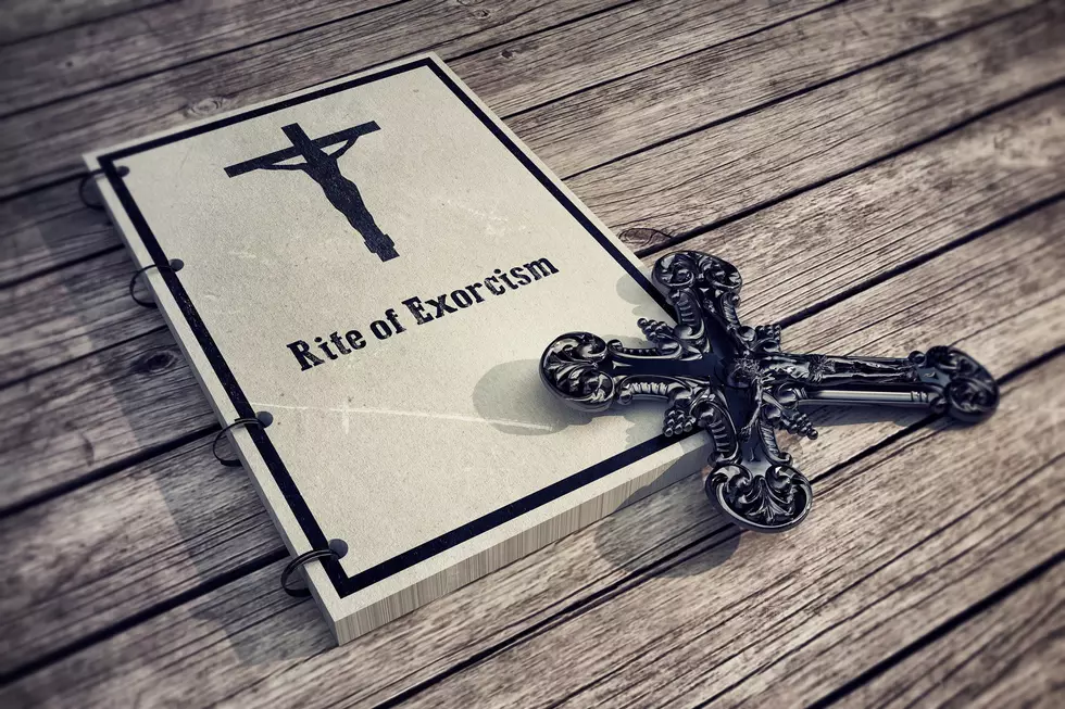3d Illustration of an exorcism book on wooden floor
