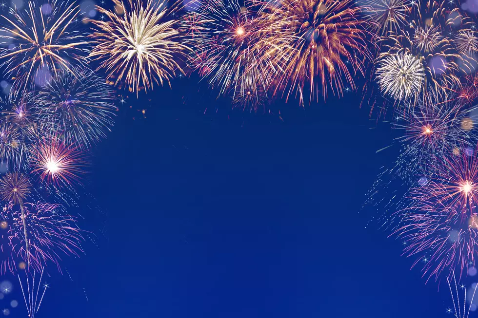new year fireworks on dark purple blue background with copy space in the middle