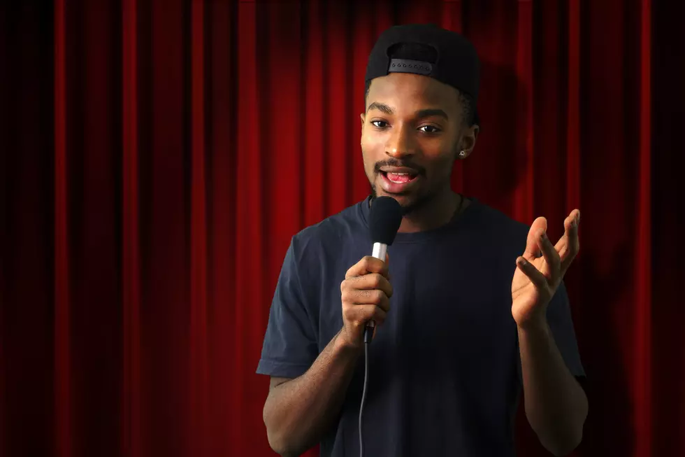 young man in concert red theater comedy vocalist singer microphone