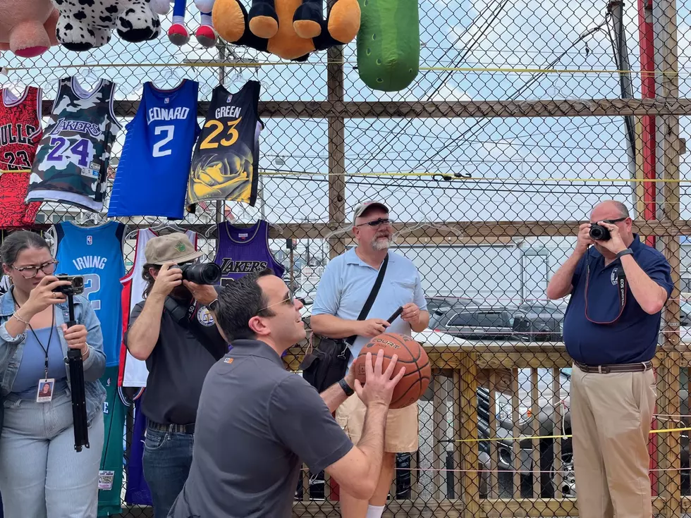 Attorney General Matthew Platkin plays a basketball stand during a visit to the boardwalk in Seaside Heights (Dino Flammia, Townsquare Media NJ)
