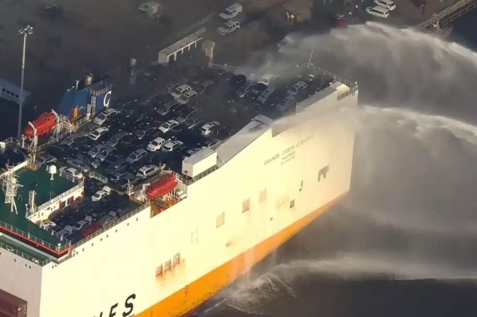 Water being poured on a cargo ship fire at Port Newark Friday morning 7/7/23