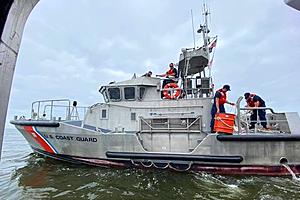 Four boaters clinging to capsized boat rescued off Sandy Hook,...