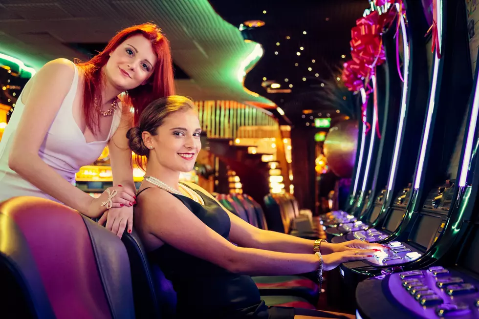 friends playin on slot machines at the casino