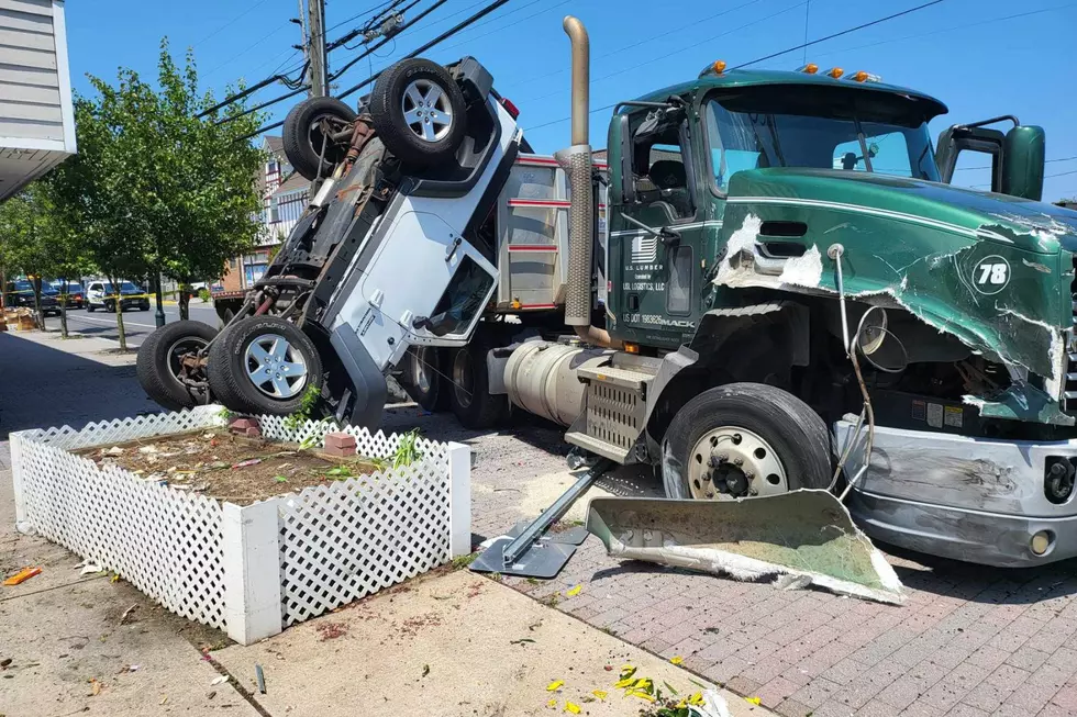Parked vehicles damaged and overturned by truck