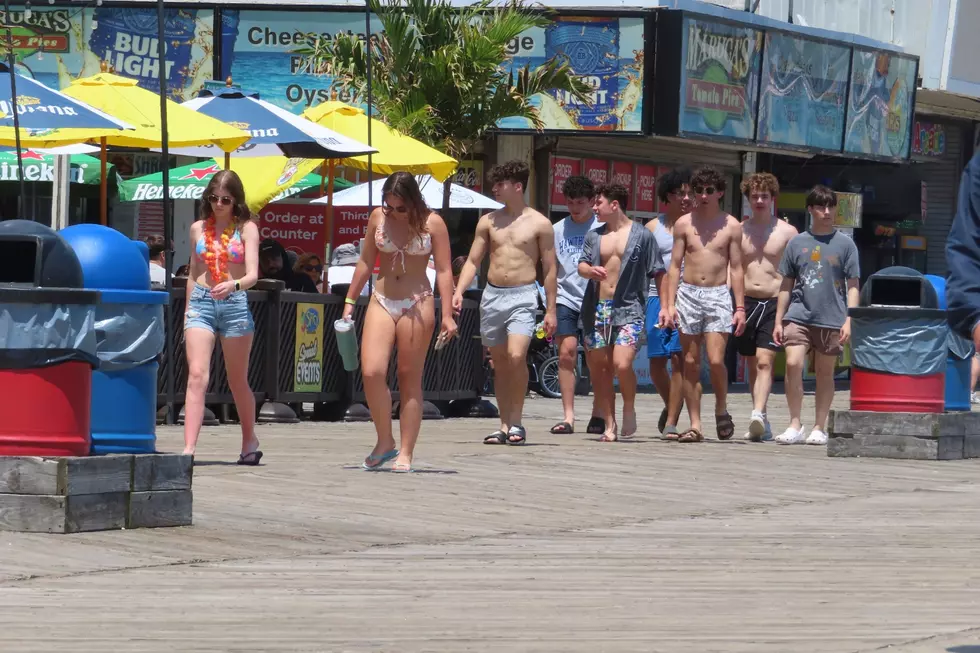 A group of young people walk peacefully along the boardwalk in Seaside Heights (AP Photo/Wayne Parry)
